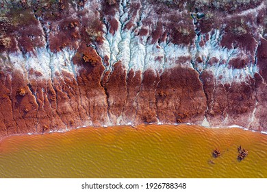 Aerial View Of A Reservoir Full Of Red Toxic Sludge. A Red Mud Storage. 