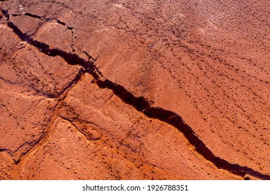 Aerial View Of A Reservoir Full Of Red Toxic Sludge. A Red Mud Storage. 