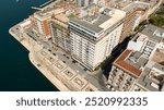 Aerial view of residential buildings on the waterfront in Taranto, Puglia, Italy.