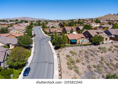 Aerial View Of A Residential District Neighborhood In The Mountains Near Reno Sparks Nevada On A Sunny Day With A Clear Blue Sky.