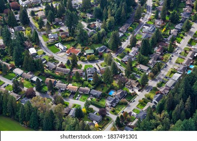 Aerial View Of Residential Homes In A Green Neighborhood During A Sunny Morning. Located In North Vancouver, British Columbia, Canada. Modern City