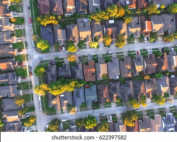 Aerial View Of Residential Houses And Driveways Neighborhood During A Fall Sunset. Tightly Packed Homes, Surrounds With Green Tree Flyover In Houston, Texas, US. Suburban Housing Community Development