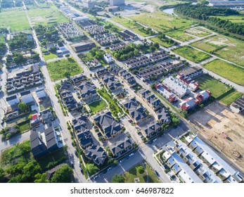 Aerial View Of Residential Houses Neighborhood In Suburban Area Of Downtown Houston, Texas, US. Tightly Packed Homes, Driveway Surrounded With Green Tree Flyover In Early Morning. Housing Development.