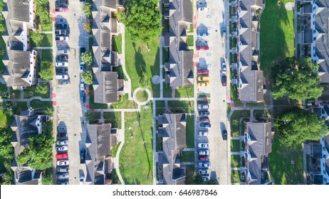 Aerial View Of Residential Houses Neighborhood In Suburban Area Of Downtown Houston, Texas, US. Tightly Packed Homes, Driveway Surrounded With Green Tree Flyover In Early Morning. Housing Development.