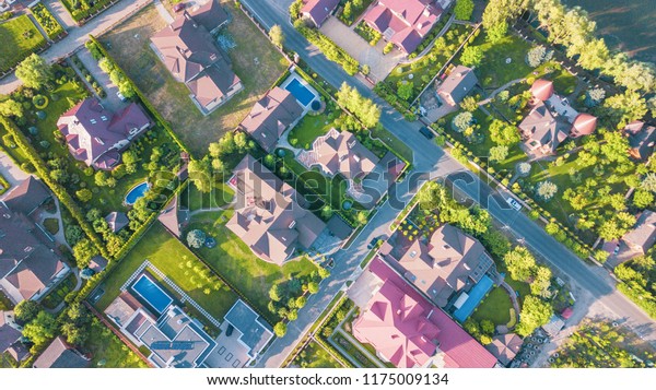 Aerial view of residential houses neighborhood in\
suburban area