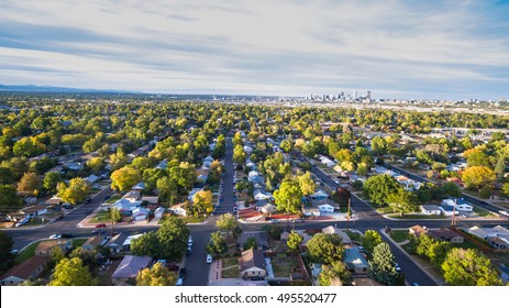 Aerial View Of Residential Neighborhood With View Of Downtown Denver.