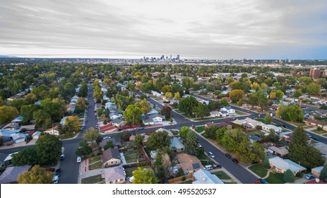 Aerial View Of Residential Neighborhood With View Of Downtown Denver.