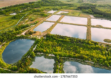 Aerial View Retention Basins, Wet Pond, Wet Detention Basin Or Stormwater Management Pond, Is An Artificial Pond With Vegetation Around The Perimeter, And Includes A Permanent Pool Of Water In Its