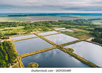 Aerial View Retention Basins, Wet Pond, Wet Detention Basin Or Stormwater Management Pond, Is An Artificial Pond With Vegetation Around The Perimeter, And Includes A Permanent Pool Of Water In Its