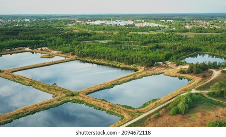 Aerial View Retention Basins, Wet Pond, Wet Detention Basin Or Stormwater Management Pond, Is An Artificial Pond With Vegetation Around The Perimeter, And Includes A Permanent Pool Of Water In Its