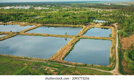 Aerial View Retention Basins, Wet Pond, Wet Detention Basin Or Stormwater Management Pond, Is An Artificial Pond With Vegetation Around The Perimeter, And Includes A Permanent Pool Of Water In Its