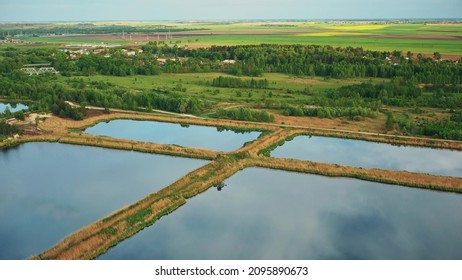 Aerial View Retention Basins, Wet Pond, Wet Detention Basin Or Stormwater Management Pond, Is An Artificial Pond With Vegetation Around The Perimeter, And Includes A Permanent Pool Of Water In Its