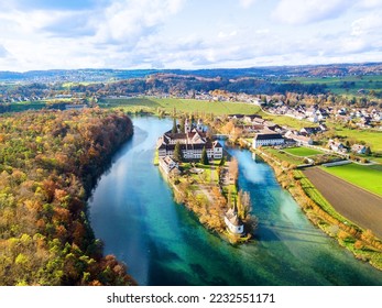 Aerial view of the Rheinau Abbey Islet on Rhine river in autumnal splendid colors, Switzerland - Shutterstock ID 2232551171