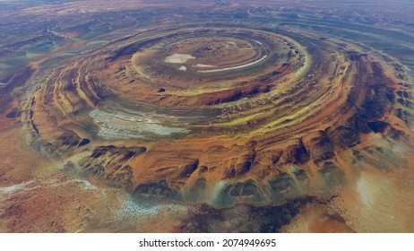 Aerial view of Richat Structure also called Guelb er Richât in Arabic Qalb ar-Rīšāt is geological feature in Sahara's Adrar Plateau westcentral Mauritania, Northwest Africa screenshot of animation - Shutterstock ID 2074949695