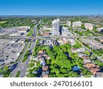 Aerial view of Richmond Hill cityscape around city center area with mall, Yonge street, buildings, nature trees and residential housing around.