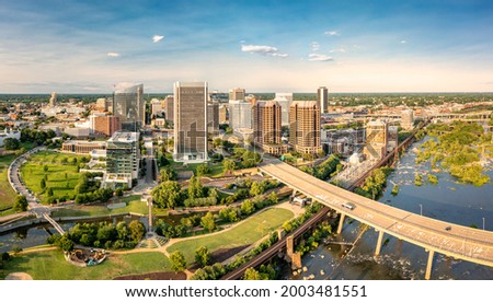 Aerial view of Richmond, Virginia, at sunset. Richmond is the capital city of the Commonwealth of Virginia. Manchester Bridge spans James River