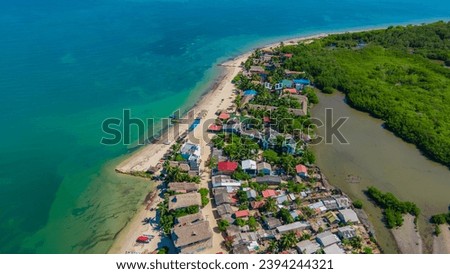 Aerial view of Rincon del Mar, a beautiful beach town in Sucre, Colombia, surrounded by lush greenery and the Caribbean Sea
