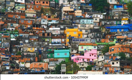 Aerial view of Rio's Rocinha favela, on a sunny afternoon. - Shutterstock ID 1054379909