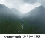 Aerial view of the River Etive as it passes through Glen Etive and Glencoe in the Scottish highlands during rain and fog