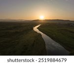 Aerial view of river guiding into sunrise over Bani Gala,  in Islamabad, Pakistan Capital