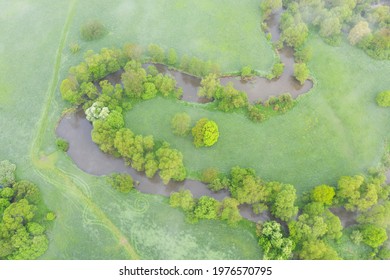 Aerial View Of River Meander In The Lush Green Vegetation Of The Delta
Top View Of The Valley Of A Meandering River Among Green Fields And Forests.
Romantic Background Concept