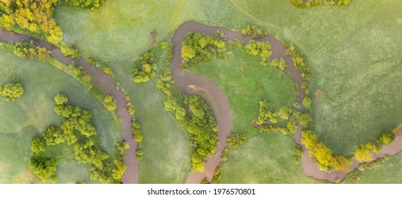 Aerial View Of River Meander In The Lush Green Vegetation Of The Delta
Top View Of The Valley Of A Meandering River Among Green Fields And Forests.
Romantic Background Concept