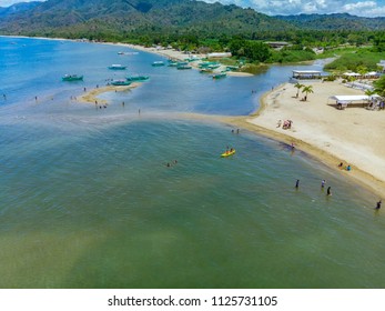 Aerial View Of The River Mouth And The Small Tidal Island On A Summer Noon At Laiya, San Juan, Batangas