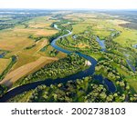 Aerial view of the river, oxbows and backswamps with trees and fields