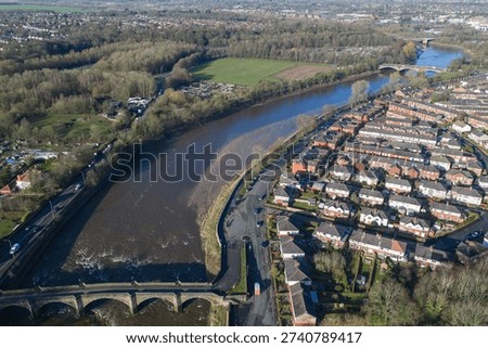 Aerial view of the River Ribble loop, Broadgate housing, and Penwortham Old Bridge
