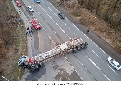 Aerial View Of Road Accident With Overturned Truck Blocking Traffic