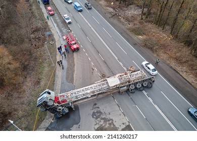 Aerial View Of Road Accident With Overturned Truck Blocking Traffic