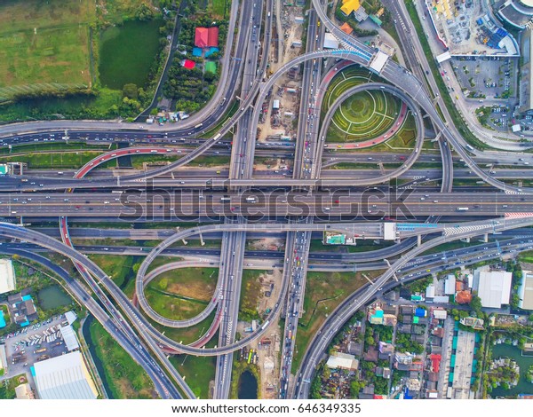 Aerial view road , beautiful street ,\
roundabout,Top view, Background , Thailand .Expressway with car\
lots in the city, downtown,\
cityscape