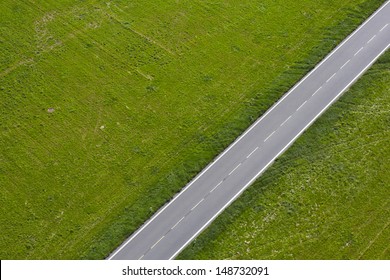 Aerial View Of Road Between Green Meadow - Copy Space