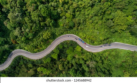 aerial view road curve construction up to mountain 