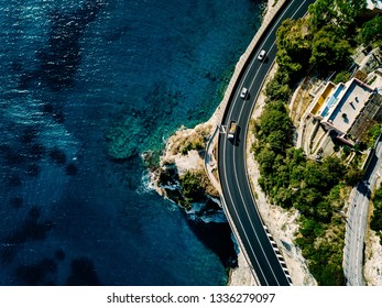 Aerial view of road going along the mountain and ocean or sea. Drone photography from above - Powered by Shutterstock