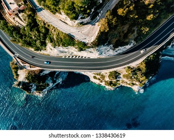 Aerial View Of Road Going Along The Mountain And Ocean Or Sea. Drone Photography From Above