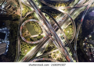 aerial view of road intersection in hangzhou at twilight - Shutterstock ID 2100391507