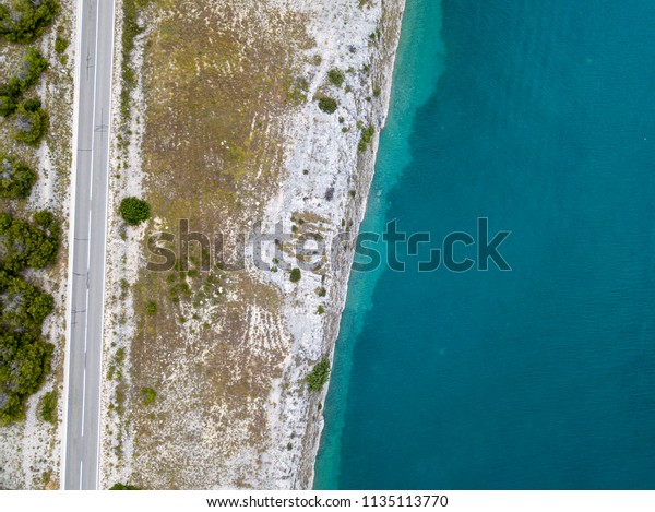 Aerial view of a road overlooking the sea,\
road that runs along the sea. Coast\
line