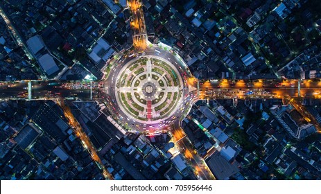 Aerial View, Road Roundabout, Expressway With Car Lots In The City In Thailand.  Beautiful Street , Downtown, Cityscape, Top View. Background