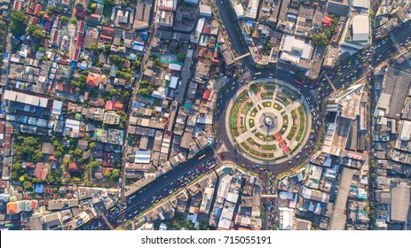 Aerial View Road Roundabout, Expressway With Car Lots In The City In Thailand.  Beautiful Street , Downtown, Cityscape, Top View,city Background , Aerial View City Scape