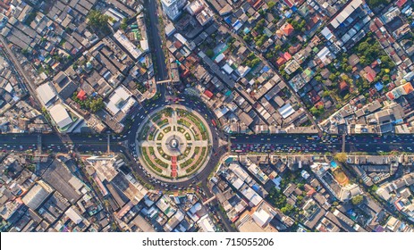 Aerial View Road Roundabout, Expressway With Car Lots In The City In Thailand.  Beautiful Street , Downtown, Cityscape, Top View,city Background , Aerial View City Scape