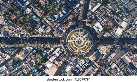 Aerial View Road Roundabout, Expressway With Car Lots In The City In Thailand.  Beautiful Street , Downtown, Cityscape, Top View,city Background , Aerial View City Scape