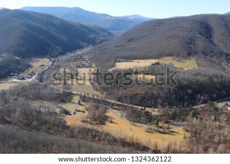 Aerial view of roads and a small town from the top of a mountain at Blackwater Falls in West Virginia