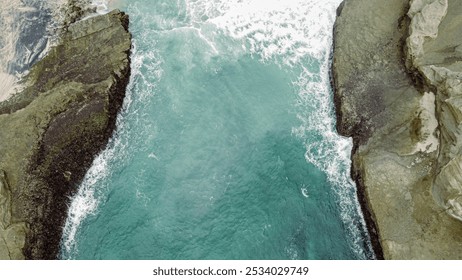 Aerial View of Rocky Coastal Cliffs and Ocean Waves - Powered by Shutterstock