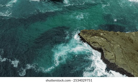 Aerial View of Rocky Coastal Cliffs and Ocean Waves - Powered by Shutterstock