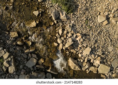 Aerial view of rocky terrain with creek. Drone photography - Shutterstock ID 2147148283