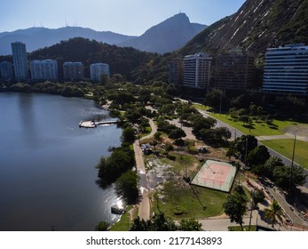 Aerial View Of Rodrigo De Freitas Lagoon, South Zone Of Rio De Janeiro, Brazil. In The Background, The Beaches Of Ipanema And Leblon. Sunny Day. Cars Traveling On Avenida Epitácio Pessoa. Drone Photo.