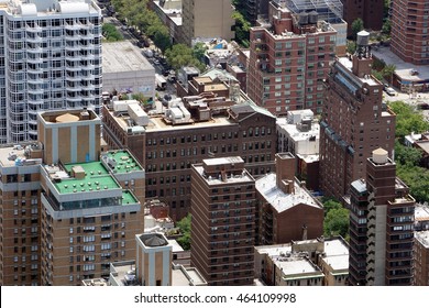 Aerial view of rooftops over a New York City housing project for low income people. High crime area for violence where police enforce at night. Daytime photo