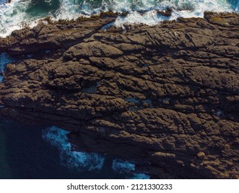 Aerial View. Rough Rocky Seashore. Raging Waves. Storm. Abstraction. Geology, Ecology, Beauty And Majesty Of Nature, Sea Travel, Swimming, Surfing, Fishing, Maritime Trade.