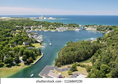 Aerial View Of Round Lake In Charlevoix, Michigan, Early Summer, With Boat Traffic.